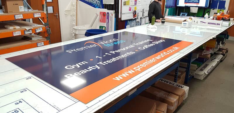 An image of a Premier sign being printed.